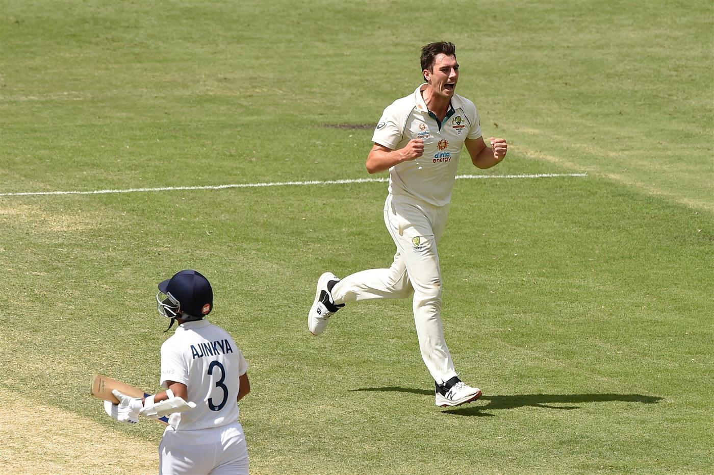 BRISBANE, AUSTRALIA - JANUARY 19: Pat Cummins of Australia celebrates taking the wicket of Ajinkya Rahane of India during day five of the 4th Test Match in the series between Australia and India at The Gabba on January 19, 2021 in Brisbane, Australia. (Photo by Matt Roberts/Getty Images)