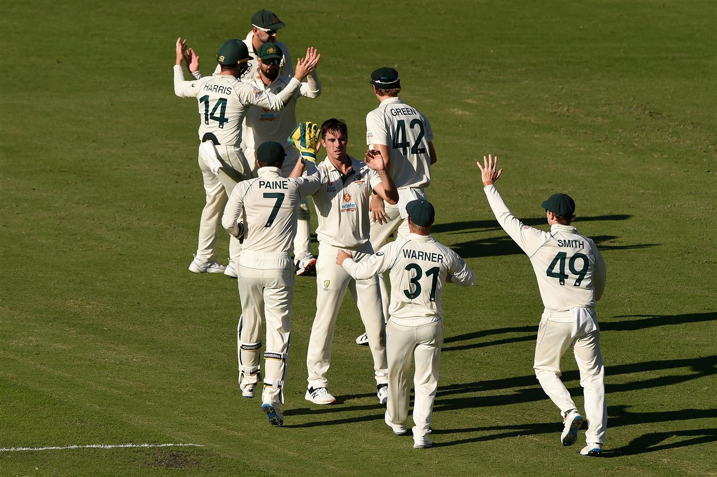 BRISBANE, AUSTRALIA - JANUARY 19: Pat Cummins of Australia celebrates taking the wicket of Mayank Agarwal of India during day five of the 4th Test Match in the series between Australia and India at The Gabba on January 19, 2021 in Brisbane, Australia. (Photo by Matt Roberts/Getty Images)