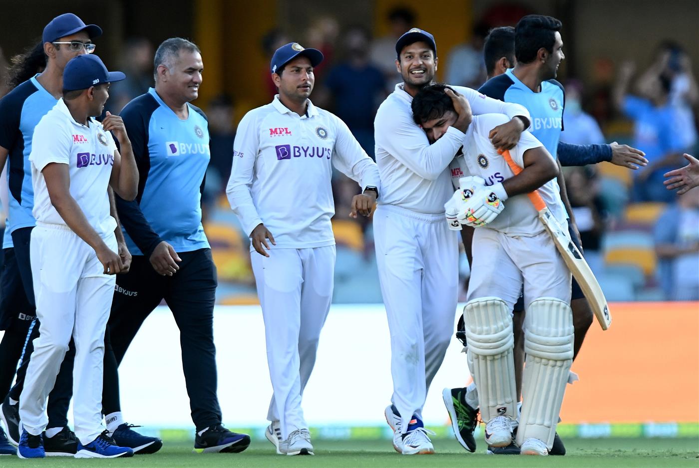 BRISBANE, AUSTRALIA - JANUARY 19: Rishabh Pant of India celebrates victory with his team mates after day five of the 4th Test Match in the series between Australia and India at The Gabba on January 19, 2021 in Brisbane, Australia. (Photo by Bradley Kanaris/Getty Images)