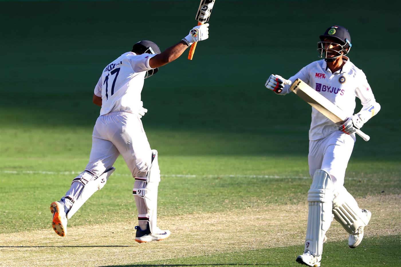 BRISBANE, AUSTRALIA - JANUARY 19: Rishabh Pant and Navdeep Saini of India celebrate victory during day five of the 4th Test Match in the series between Australia and India at The Gabba on January 19, 2021 in Brisbane, Australia. (Photo by Matt Roberts/Getty Images)