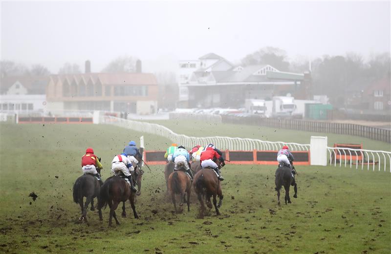CATTERICK, ENGLAND - FEBRUARY 05: Runners and riders in the kingmakerracedays.co.uk Celebrate Mary Harle's 101st Birthday Handicap Hurdle race at Catterick Racecourse on February 5, 2021 in Catterick, England. (Photo by Tim Goode - Pool / Getty Images)