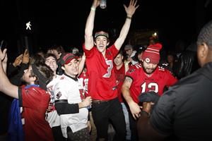 TAMPA, FL - FEBRUARY 07: Tampa Bay Buccaneers fans celebrate after Super Bowl LV on February 7, 2021 in Tampa, Florida. Tampa Bay won in dominating fashion 31-9 over defending champ Kansas City Chiefs, securing for 43-year-old quarterback Tom Brady his seventh Lombardi Trophy, two more than any player in NFL history. (Photo by Octavio Jones/Getty Images)