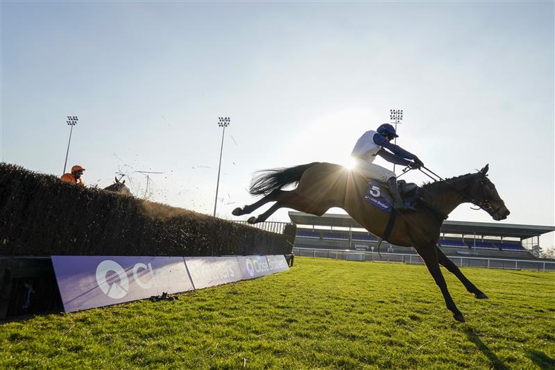 SUNBURY, ENGLAND - FEBRUARY 27: Jonathan Burke riding Clondaw Castle clear the last to win The Close Brothers Handicap Chase at Kempton Park Racecourse on February 27, 2021 in Sunbury, England. Due to the coronavirus pandemic, owners along with the paying public will not be allowed to attend the meeting. (Photo by Alan Crowhurst/Getty Images)