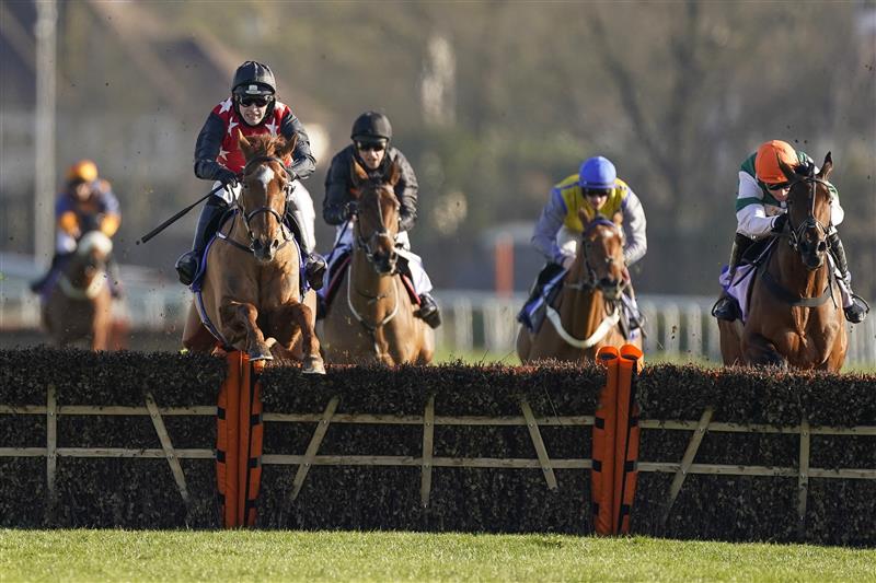 SUNBURY, ENGLAND - FEBRUARY 27: Jonjo O'Neill Jr riding Cape Gentleman (red/black) clear the last to win The Sky Bet Dovecote Novices' Hurdle at Kempton Park Racecourse on February 27, 2021 in Sunbury, England. Due to the coronavirus pandemic, owners along with the paying public will not be allowed to attend the meeting. (Photo by Alan Crowhurst/Getty Images)