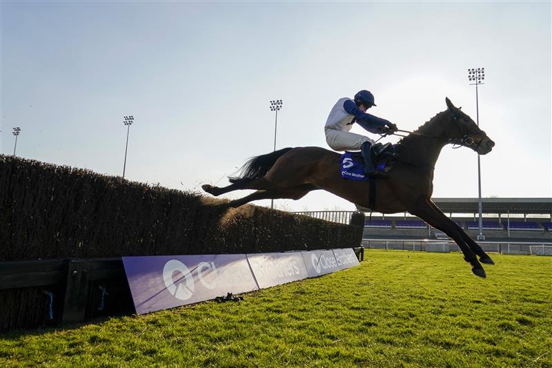 SUNBURY, ENGLAND - FEBRUARY 27: Jonathan Burke riding Clondaw Castle clear the last to win The Close Brothers Handicap Chase at Kempton Park Racecourse on February 27, 2021 in Sunbury, England. Due to the coronavirus pandemic, owners along with the paying public will not be allowed to attend the meeting. (Photo by Alan Crowhurst/Getty Images)