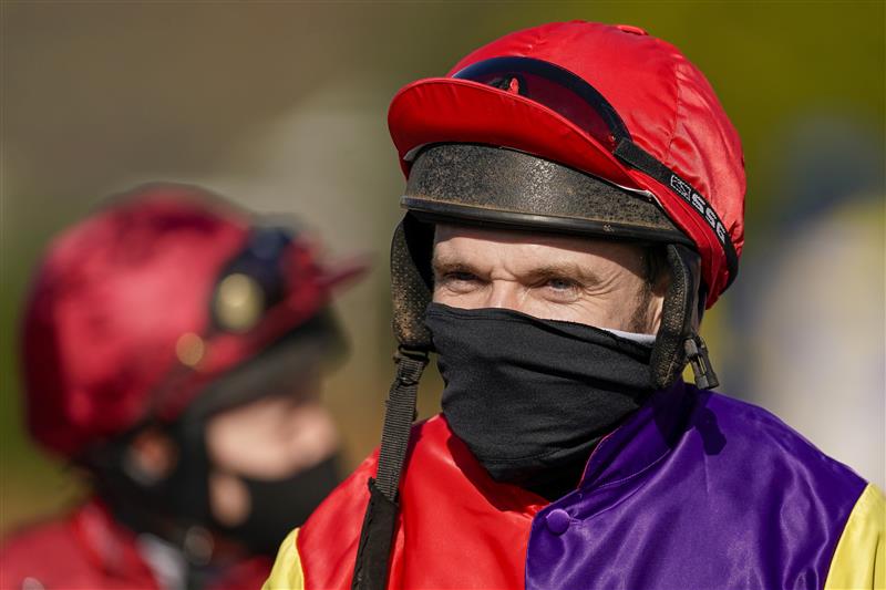 SUNBURY, ENGLAND - FEBRUARY 27: Tom Scudamore on his way to the parade ring at Kempton Park Racecourse on February 27, 2021 in Sunbury, England. Due to the coronavirus pandemic, owners along with the paying public will not be allowed to attend the meeting. (Photo by Alan Crowhurst/Getty Images)