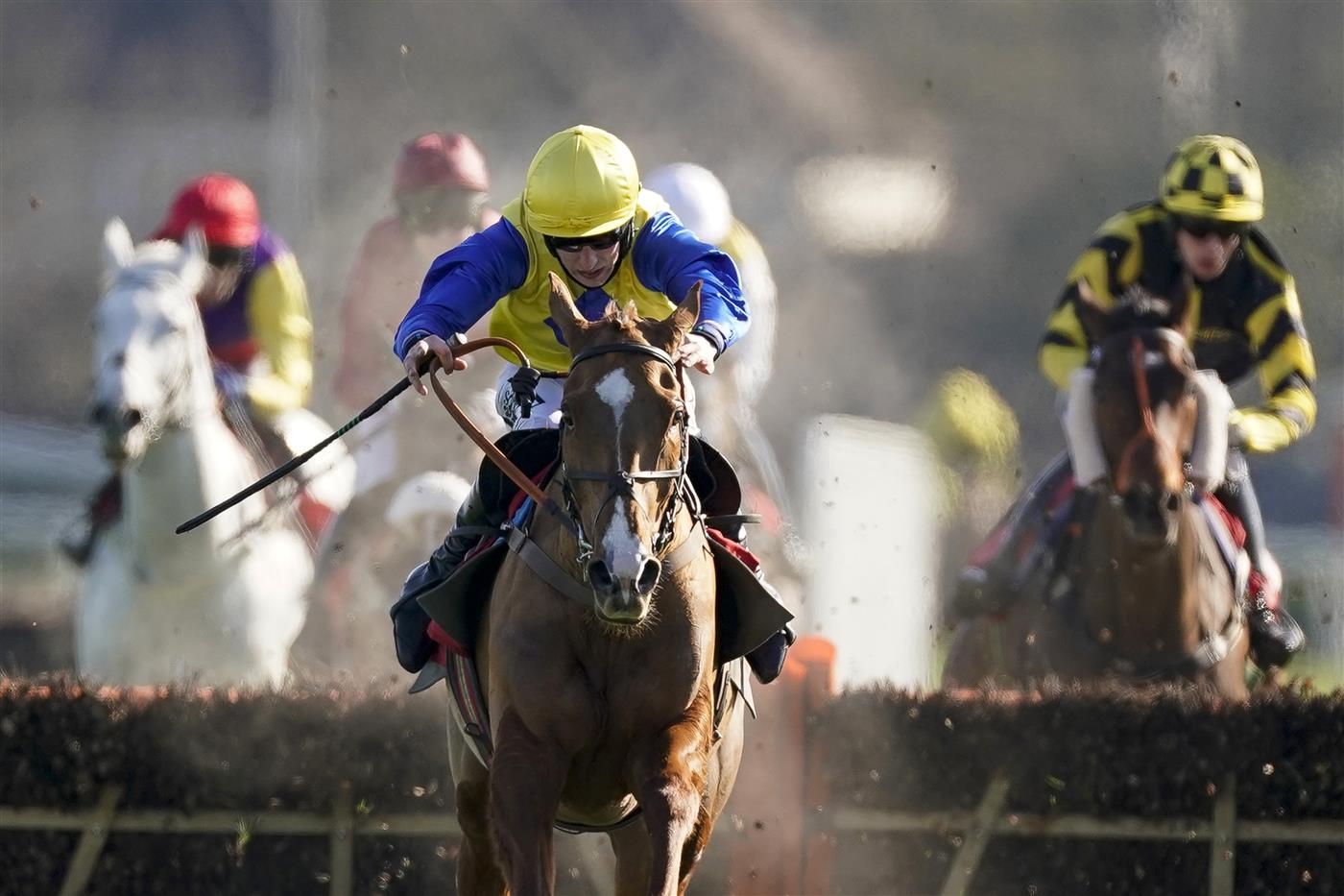 SUNBURY, ENGLAND - FEBRUARY 27: Ciaran Gethings riding Hometown Boy clear the last to win The Close Brothers Asset Finance Handicap Hurdle at Kempton Park Racecourse on February 27, 2021 in Sunbury, England. Due to the coronavirus pandemic, owners along with the paying public will not be allowed to attend the meeting. (Photo by Alan Crowhurst/Getty Images)