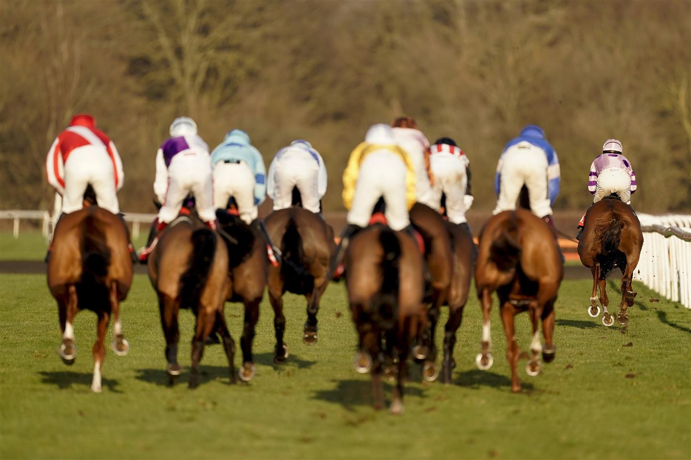 SUNBURY, ENGLAND - FEBRUARY 27: Harry Cobden riding My Way (R, pink) on their way to winning The Close Brothers Motor Finance Handicap Chase at Kempton Park Racecourse on February 27, 2021 in Sunbury, England. Due to the coronavirus pandemic, owners along with the paying public will not be allowed to attend the meeting. (Photo by Alan Crowhurst/Getty Images)