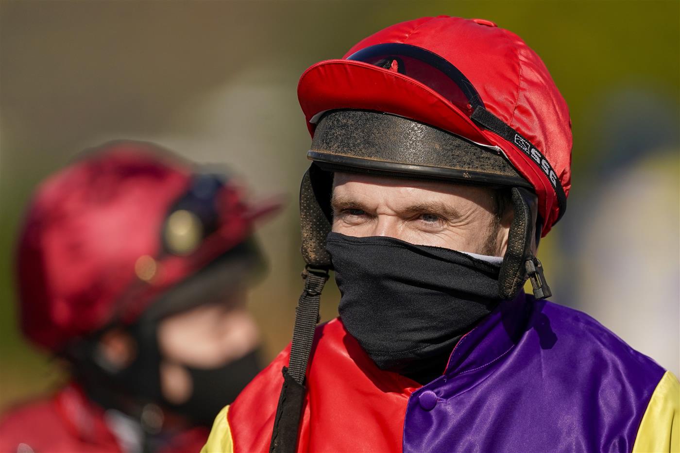 SUNBURY, ENGLAND - FEBRUARY 27: Tom Scudamore on his way to the parade ring at Kempton Park Racecourse on February 27, 2021 in Sunbury, England. Due to the coronavirus pandemic, owners along with the paying public will not be allowed to attend the meeting. (Photo by Alan Crowhurst/Getty Images)