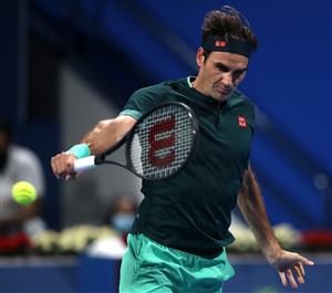 DOHA, QATAR - MARCH 10: Roger Federer of Switzerland returns a backhand in his match against Dan Evans of Great Britain on Day 3 of the Qatar ExxonMobil Open at Khalifa International Tennis and Squash Complex on March 10, 2021 in Doha, Qatar. (Photo by Mohamed Farag/Getty Images)