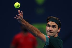 DOHA, QATAR - MARCH 10: Roger Federer of Switzerland serves in his match against Dan Evans of Great Britain on Day 3 of the Qatar ExxonMobil Open at Khalifa International Tennis and Squash Complex on March 10, 2021 in Doha, Qatar. (Photo by Mohamed Farag/Getty Images)