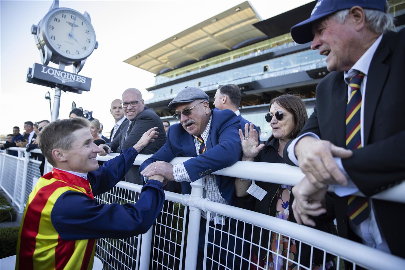 SYDNEY, AUSTRALIA - APRIL 10: Winning connections of Nature Strip congratulate James McDonald after winning the Heineken T J Smith Stakes during the Championships Day 1 at Royal Randwick Racecourse on April 10, 2021 in Sydney, Australia. A COVID-restricted crowd of 15,000 is expected to attend Day 1 of The Championships, the highlight of the Sydney Autumn Racing Carnival. The 2020 event was restricted to participants and essential staff only in the height of the coronavirus pandemic. The Championships Day 1 featuring four Group 1 events headlined by the $3 million Doncaster Mile and $2 million Australian Derby. (Photo by Jenny Evans/Getty Images)