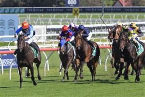 SYDNEY, AUSTRALIA - APRIL 10: Hugh Bowman on Duais wins race 4 the TAB Adrian Knox Stakes during The Championships at Royal Randwick Racecourse on April 10, 2021 in Sydney, Australia. (Photo by Mark Evans/Getty Images)