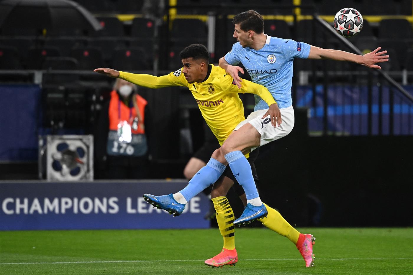 Dortmund's German forward Ansgar Knauff (L) and Manchester City's Portuguese defender Ruben Dias vie for the ball during the UEFA Champions League quarter-final second leg football match between BVB Borussia Dortmund and Manchester City in Dortmund, western Germany, on April 14, 2021. (Photo by Ina Fassbender / various sources / AFP) (Photo by INA FASSBENDER/AFP via Getty Images)