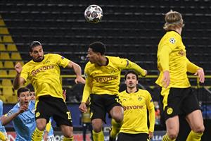 Players including Dortmund's German midfielder Emre Can, Dortmund's English midfielder Jude Bellingham and Dortmund's Norwegian forward Erling Braut Haaland jump tp head the ball during a corner kick during the UEFA Champions League quarter-final second leg football match between BVB Borussia Dortmund and Manchester City in Dortmund, western Germany, on April 14, 2021. (Photo by Ina Fassbender / various sources / AFP) (Photo by INA FASSBENDER/AFP via Getty Images)