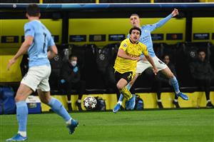 Manchester City's English midfielder Phil Foden (R) and Dortmund's Spanish defender Mateu Morey (C) vie for the ball during the UEFA Champions League quarter-final second leg football match between BVB Borussia Dortmund and Manchester City in Dortmund, western Germany, on April 14, 2021. (Photo by Ina Fassbender / various sources / AFP) (Photo by INA FASSBENDER/AFP via Getty Images)