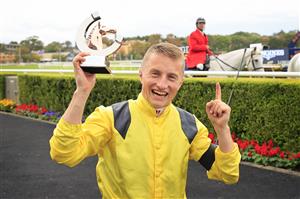 SYDNEY, AUSTRALIA - APRIL 17: Tom Marquand poses with his Trophy after winning race 8 the Longines Queen Elizabeth Stakes on Addeybb during day two of The Championships at Royal Randwick Racecourse on April 17, 2021 in Sydney, Australia. (Photo by Mark Evans/Getty Images)
