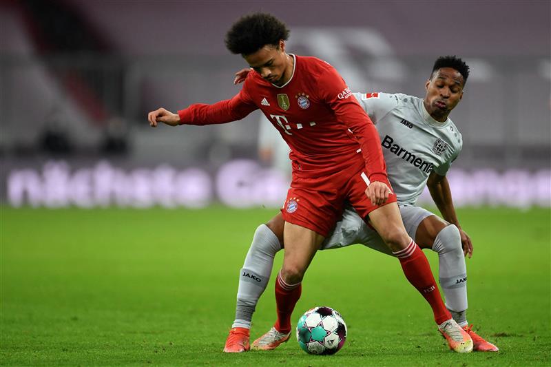 Bayern Munich's German midfielder Leroy Sane (L) and Leverkusen's Brazilian defender Wendell vie for the ball the German first division Bundesliga football match FC Bayern Munich vs Bayer 04 Leverkusen in Munich, southern Germany, on April 20, 2021.  (Getty Images)