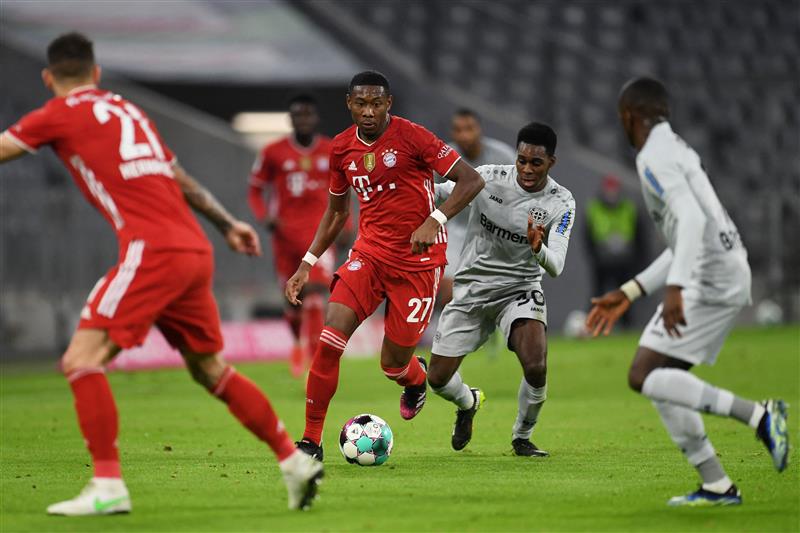 Bayern Munich's Austrian defender David Alaba (2L) and Leverkusen's Dutch defender Jeremie Frimpong (2R) vie for the ball during the German first division Bundesliga football match FC Bayern Munich vs Bayer 04 Leverkusen in Munich, southern Germany, on April 20, 2021.  (Getty Images)