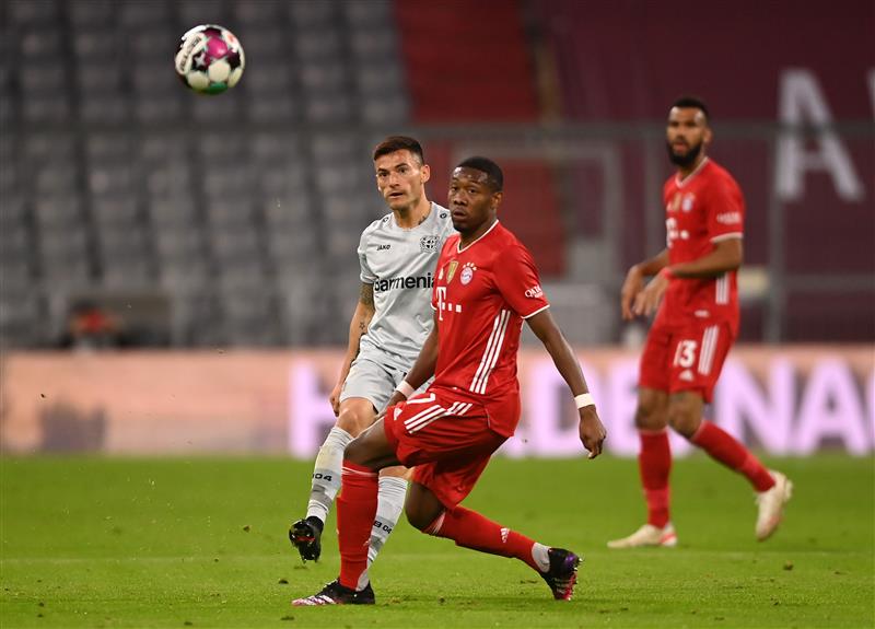MUNICH, GERMANY - APRIL 20: Charles Aranguiz of Bayer 04 Leverkusen is challenged by David Alaba of FC Bayern Muenchen during the Bundesliga match between FC Bayern Muenchen and Bayer 04 Leverkusen at Allianz Arena on April 20, 2021 in Munich, Germany.  (Getty Images)
