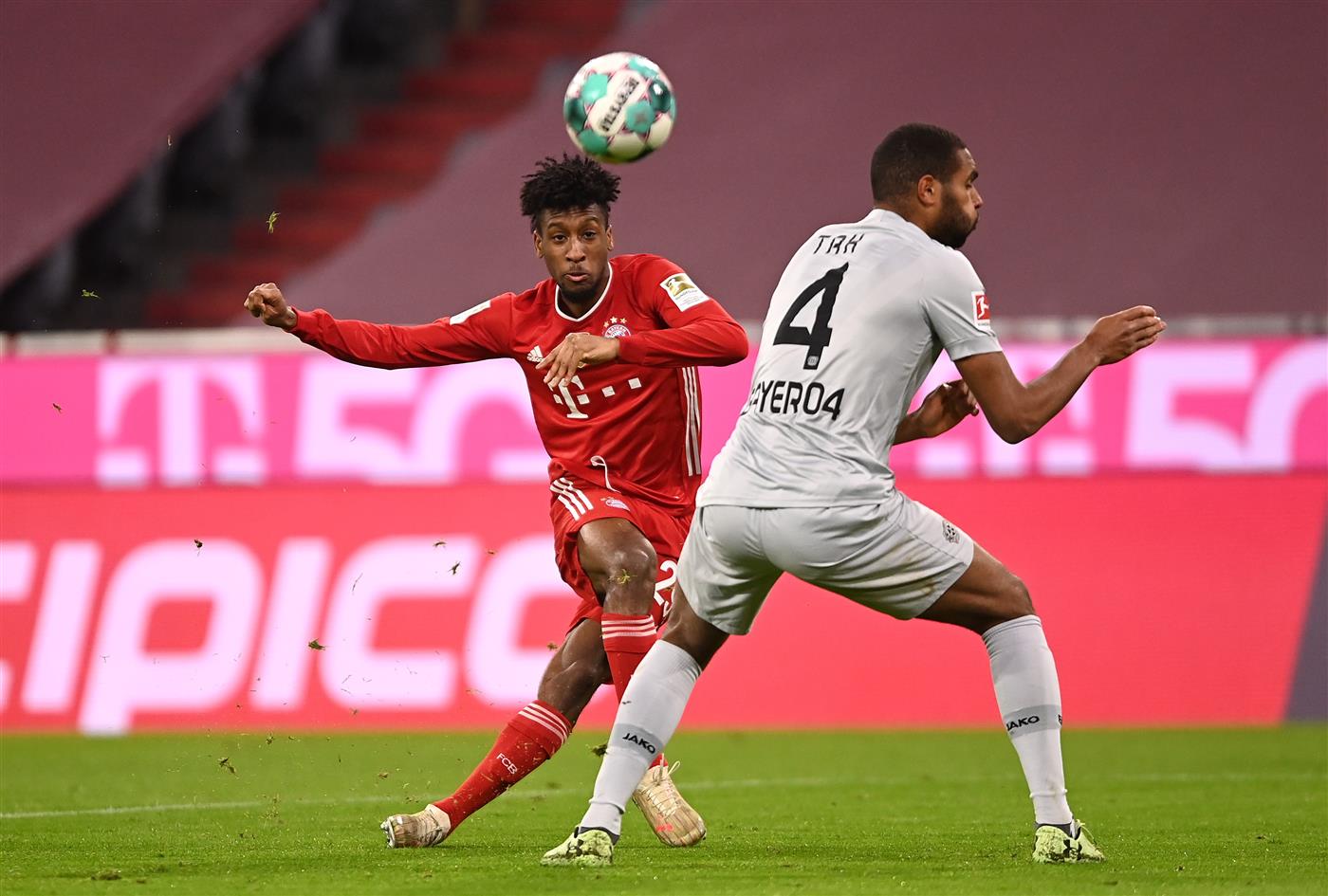 MUNICH, GERMANY - APRIL 20: Kingsley Coman of FC Bayern Muenchen and Jonathan Tah of Bayer Leverkusen  battle for the ball  during the Bundesliga match between FC Bayern Muenchen and Bayer 04 Leverkusen at Allianz Arena on April 20, 2021 in Munich, Germany.  (Getty Images)