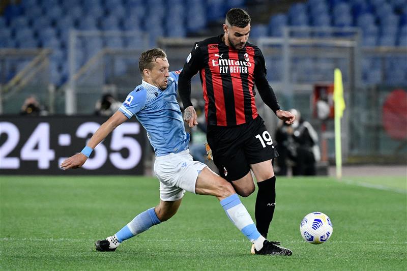 Lazio's Brazilian midfielder Lucas Leiva (L) vies with AC Milan's French defender Theo Hernandez during the Italian Serie A football match Lazio vs Ac Milan at Olympic stadium in Rome on April 26, 2021. (Getty Images)