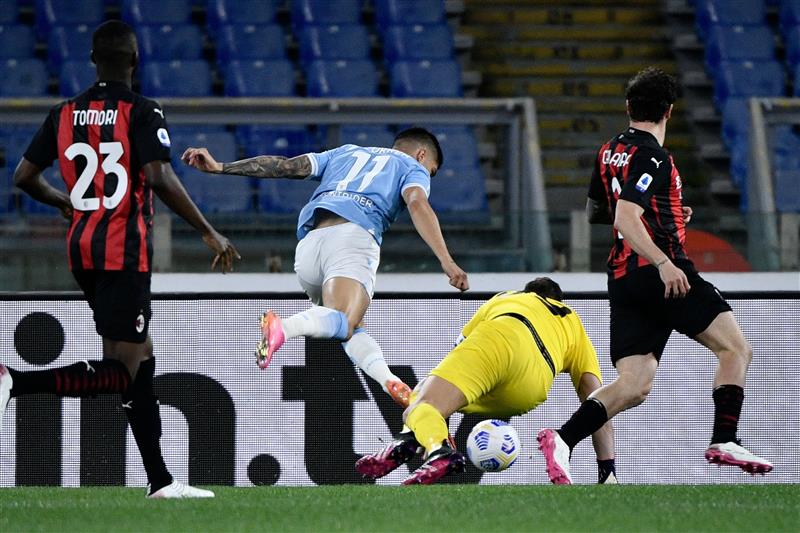 Lazio's Argentine forward Joaquin Correa (R) kicks the ball to score during the Italian Serie A football match Lazio vs Ac Milan at Olympic stadium in Rome on April 26, 2021. (Getty Images)