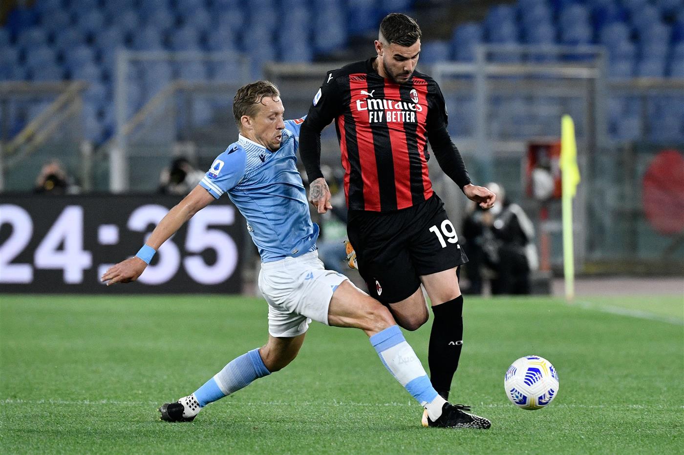 Lazio's Brazilian midfielder Lucas Leiva (L) vies with AC Milan's French defender Theo Hernandez during the Italian Serie A football match Lazio vs Ac Milan at Olympic stadium in Rome on April 26, 2021. (Getty Images)