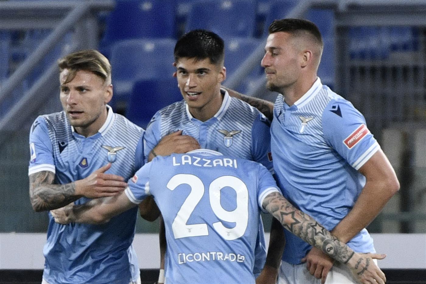 Lazio's Argentine forward Joaquin Correa (C) celebrates after scoring a goal with team mates Italian forward Ciro Immobile (L), Serbian midfielder Sergej Milinkovic-Savic (R) and Italian midfielder Manuel Lazzari during the Italian Serie A football match between Lazio and Ac Milan on April 26, 2021 at the Olympic stadium in Rome. (Getty Images)