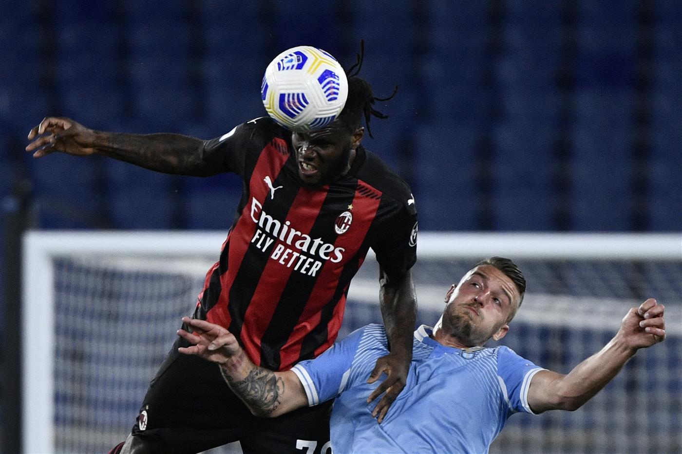 AC Milan's Ivorian midfielder Franck Kessie (L) vies with Lazio's Serbian midfielder Sergej Milinkovic-Savic during the Italian Serie A football match Lazio vs Ac Milan at Olympic stadium in Rome on April 26, 2021. (Getty Images)
