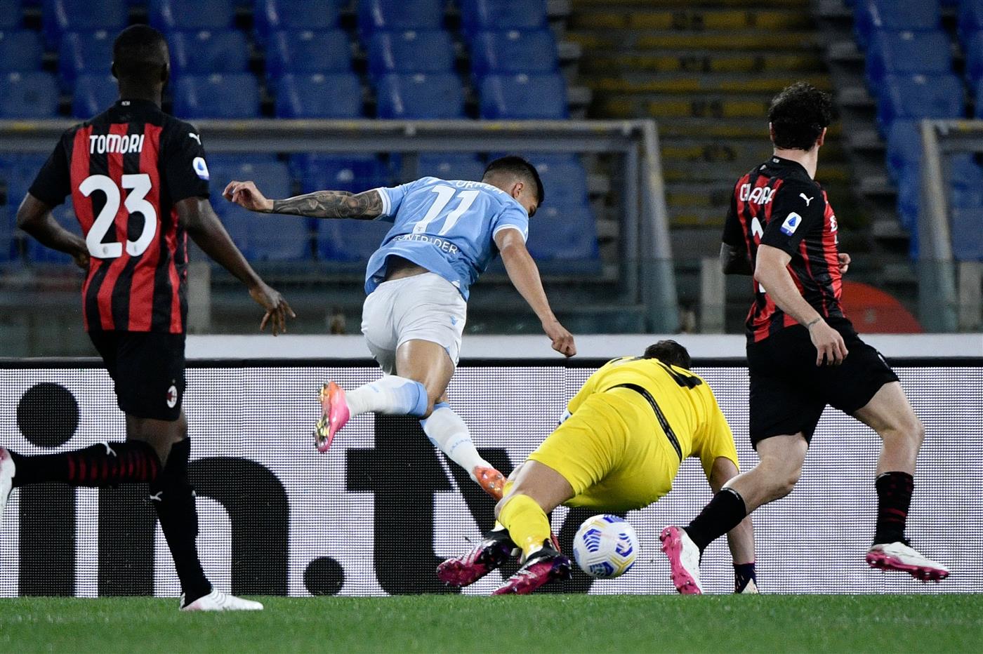 Lazio's Argentine forward Joaquin Correa (R) kicks the ball to score during the Italian Serie A football match Lazio vs Ac Milan at Olympic stadium in Rome on April 26, 2021. (Getty Images)