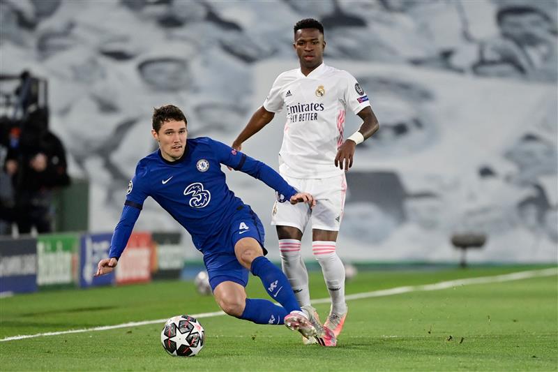 Real Madrid's Brazilian forward Vinicius Junior (R) challenges Chelsea's Danish defender Andreas Christensen during the UEFA Champions League semi-final first leg football match between Real Madrid and Chelsea at the Alfredo di Stefano stadium in Valdebebas, on the outskirts of Madrid, on April 27, 2021. (Getty Images)