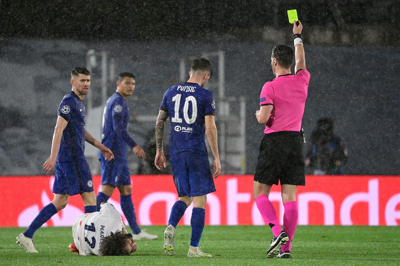 Dutch referee Danny Makkelie shows a yellow card to Chelsea's American midfielder Christian Pulisic during the UEFA Champions League semi-final first leg football match between Real Madrid and Chelsea at the Alfredo di Stefano stadium in Valdebebas, on the outskirts of Madrid, on April 27, 2021. (Getty Images)