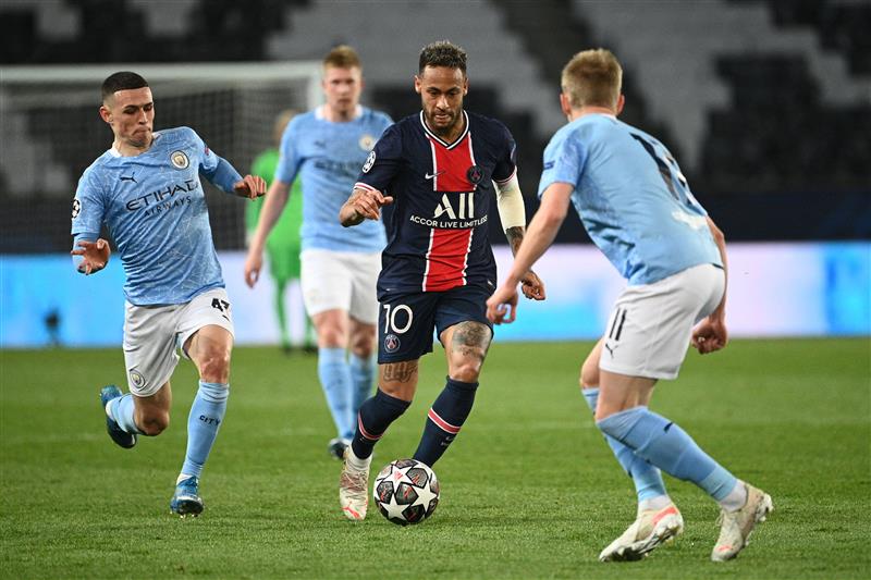 Paris Saint-Germain's Brazilian forward Neymar drives the ball during the UEFA Champions League first leg semi-final football match between Paris Saint-Germain (PSG) and Manchester City at the Parc des Princes stadium in Paris on April 28, 2021. (Getty Images)