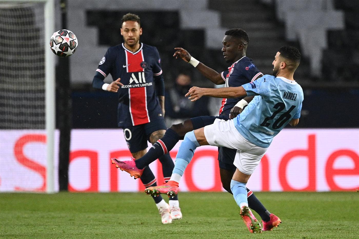 Paris Saint-Germain's Senegalese midfielder Idrissa Gueye (C) fights for the ball with Manchester City's Algerian midfielder Riyad Mahrez (R) during the UEFA Champions League first leg semi-final football match between Paris Saint-Germain (PSG) and Manchester City at the Parc des Princes stadium in Paris on April 28, 2021. (Getty Images)