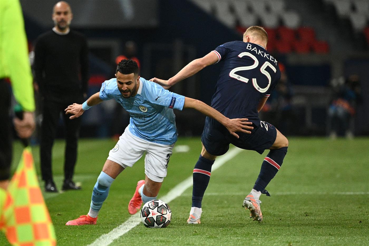 Manchester City's Algerian midfielder Riyad Mahrez (L) fights for the ball with Paris Saint-Germain's Dutch defender Mitchel Bakker during the UEFA Champions League first leg semi-final football match between Paris Saint-Germain (PSG) and Manchester City at the Parc des Princes stadium in Paris on April 28, 2021. (Getty Images)