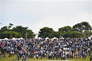 WARRNAMBOOL, AUSTRALIA - MAY 06: Racegoers on the hill watch Race 7, the Grand Annual Steeplechase, on Grand Annual Day during the Warrnambool Jumps Carnival at Warrnambool Racing Club on May 06, 2021 in Warrnambool, Australia. (Photo by Vince Caligiuri/Getty Images)