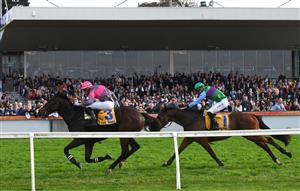 WARRNAMBOOL, AUSTRALIA - MAY 06: Clayton Douglas riding Gold Medals defeating Aaron Kuru riding Zed Em in Race 7, the Grand Annual Steeplechase, on Grand Annual Day during the Warrnambool Jumps Carnival at Warrnambool Racing Club on May 06, 2021 in Warrnambool, Australia. (Photo by Vince Caligiuri/Getty Images)