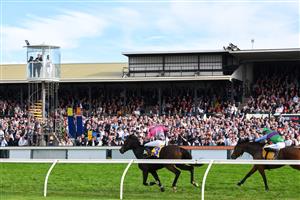 WARRNAMBOOL, AUSTRALIA - MAY 06: Clayton Douglas riding Gold Medals defeating Aaron Kuru riding Zed Em in Race 7, the Grand Annual Steeplechase, on Grand Annual Day during the Warrnambool Jumps Carnival at Warrnambool Racing Club on May 06, 2021 in Warrnambool, Australia. (Photo by Vince Caligiuri/Getty Images)