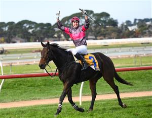 WARRNAMBOOL, AUSTRALIA - MAY 06: Clayton Douglas riding Gold Medals reacts after defeating Aaron Kuru riding Zed Em in Race 7, the Grand Annual Steeplechase, on Grand Annual Day during the Warrnambool Jumps Carnival at Warrnambool Racing Club on May 06, 2021 in Warrnambool, Australia. (Photo by Vince Caligiuri/Getty Images)