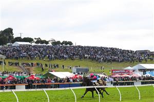 WARRNAMBOOL, AUSTRALIA - MAY 06: Clayton Douglas riding Gold Medals defeating Aaron Kuru riding Zed Em in Race 7, the Grand Annual Steeplechase, on Grand Annual Day during the Warrnambool Jumps Carnival at Warrnambool Racing Club on May 06, 2021 in Warrnambool, Australia. (Photo by Vince Caligiuri/Getty Images)