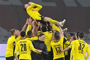 Dortmund's Polish defender Lukasz Piszczek (top) is thrown in the air by his teammates after the German Cup (DFB Pokal) final football match RB Leipzig v BVB Borussia Dortmund, in Berlin on May 13, 2021. (Getty Images)