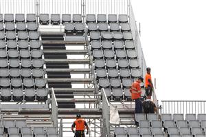 TOWNSVILLE, AUSTRALIA - JUNE 08: Workmen add extra seating the temporary grandstand before a Queensland Maroons State of Origin training session at Queensland Country Bank Stadium on June 08, 2021 in Townsville, Australia. (Photo by Mark Kolbe/Getty Images)