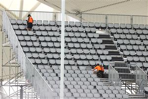 TOWNSVILLE, AUSTRALIA - JUNE 08: Workmen add extra seating the temporary grandstand before a Queensland Maroons State of Origin training session at Queensland Country Bank Stadium on June 08, 2021 in Townsville, Australia. (Photo by Mark Kolbe/Getty Images)