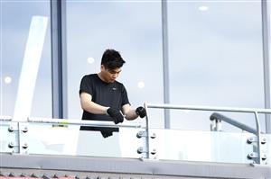 TOWNSVILLE, AUSTRALIA - JUNE 08: Worker adds finishing touches in the grandstand before a Queensland Maroons State of Origin training session at Queensland Country Bank Stadium on June 08, 2021 in Townsville, Australia. (Photo by Mark Kolbe/Getty Images)