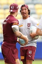 TOWNSVILLE, AUSTRALIA - JUNE 08: Cameron Munster shares a joke with Johnathan Thurston during a Queensland Maroons State of Origin training session at Queensland Country Bank Stadium on June 08, 2021 in Townsville, Australia. (Photo by Mark Kolbe/Getty Images)