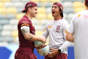 TOWNSVILLE, AUSTRALIA - JUNE 08: Cameron Munster shares a joke with Johnathan Thurston during a Queensland Maroons State of Origin training session at Queensland Country Bank Stadium on June 08, 2021 in Townsville, Australia. (Photo by Mark Kolbe/Getty Images)
