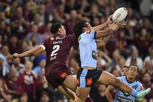 TOWNSVILLE, AUSTRALIA - JUNE 09: Xavier Coates of the Maroons and Brian To'o of the Blues compete for the ball is tackled during game one of the 2021 State of Origin series between the New South Wales Blues and the Queensland Maroons at Queensland Country Bank Stadium on June 09, 2021 in Townsville, Australia. (Photo by Ian Hitchcock/Getty Images)