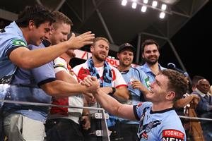 TOWNSVILLE, AUSTRALIA - JUNE 09: Liam Martin of the Blues poses with fans after winning game one of the 2021 State of Origin series between the New South Wales Blues and the Queensland Maroons at Queensland Country Bank Stadium on June 09, 2021 in Townsville, Australia. (Photo by Mark Kolbe/Getty Images)