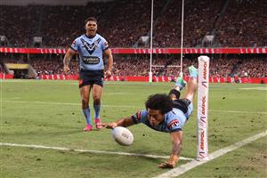 TOWNSVILLE, AUSTRALIA - JUNE 09: Brian To'o of the Blues scores a try during game one of the 2021 State of Origin series between the New South Wales Blues and the Queensland Maroons at Queensland Country Bank Stadium on June 09, 2021 in Townsville, Australia. (Photo by Mark Kolbe/Getty Images)